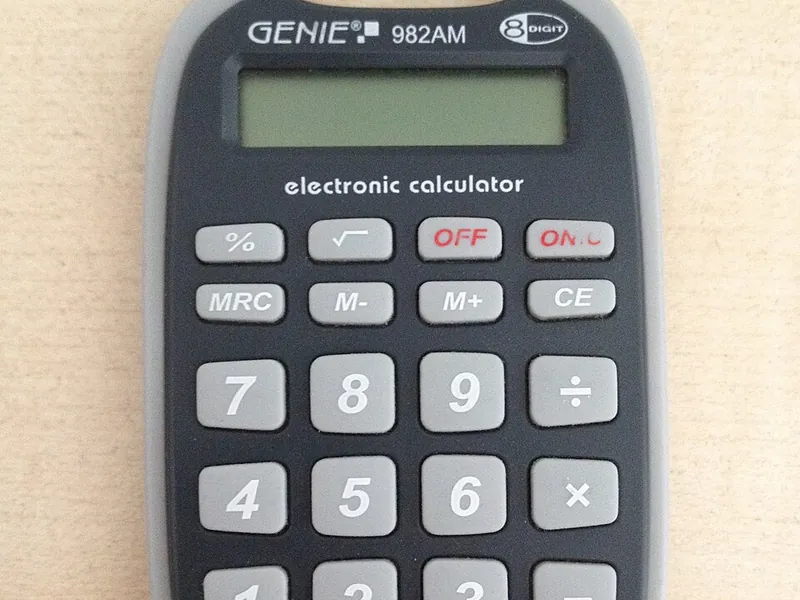 Pocket calculator showing its display and memory, percent and arithmetic keys